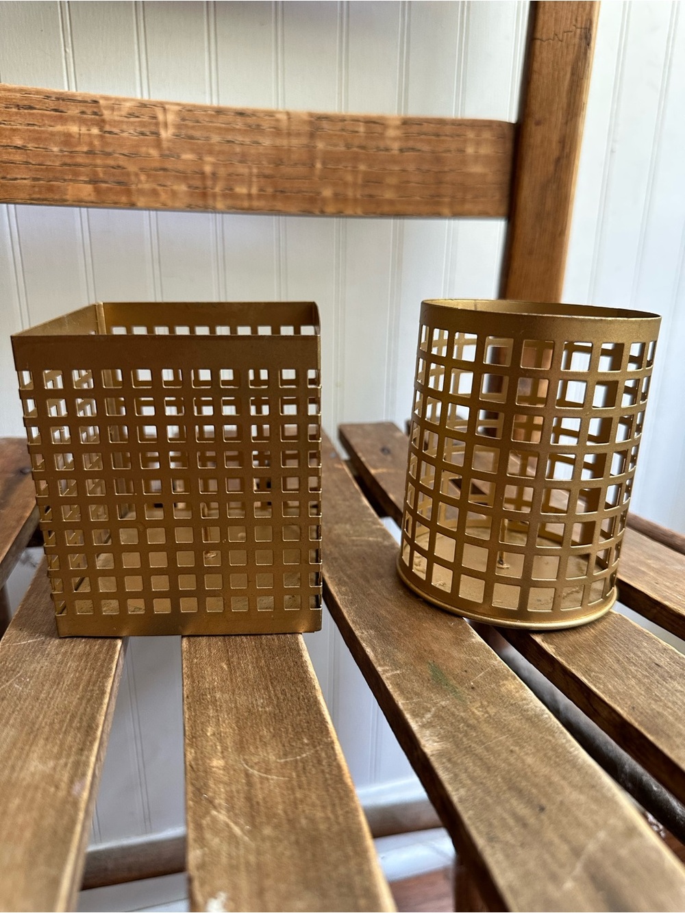 Gold colored metal candleholders • set of two